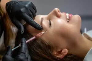 woman getting temple filler in miami beach