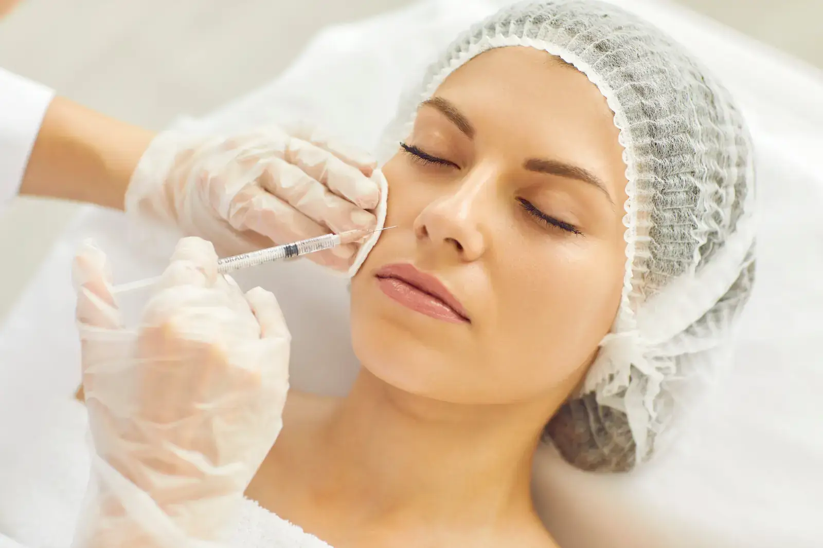 Nasolabial fold treatment in Miami Beach - nurse practitioner injecting near the smile line